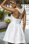 White Dress with Beaded Back Detail & Pleated Skirt